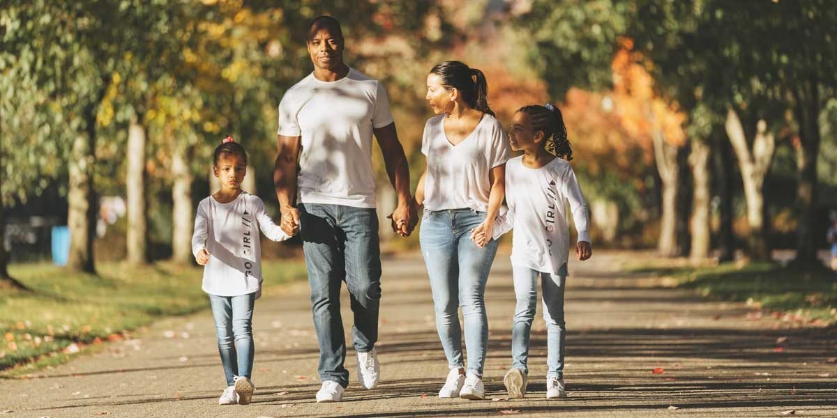 Tommy europe and family walking in a park