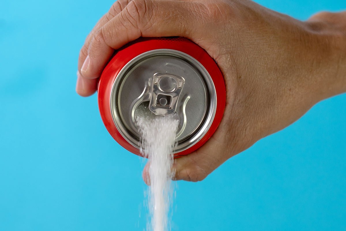 Pouring out a sugar-packed soda