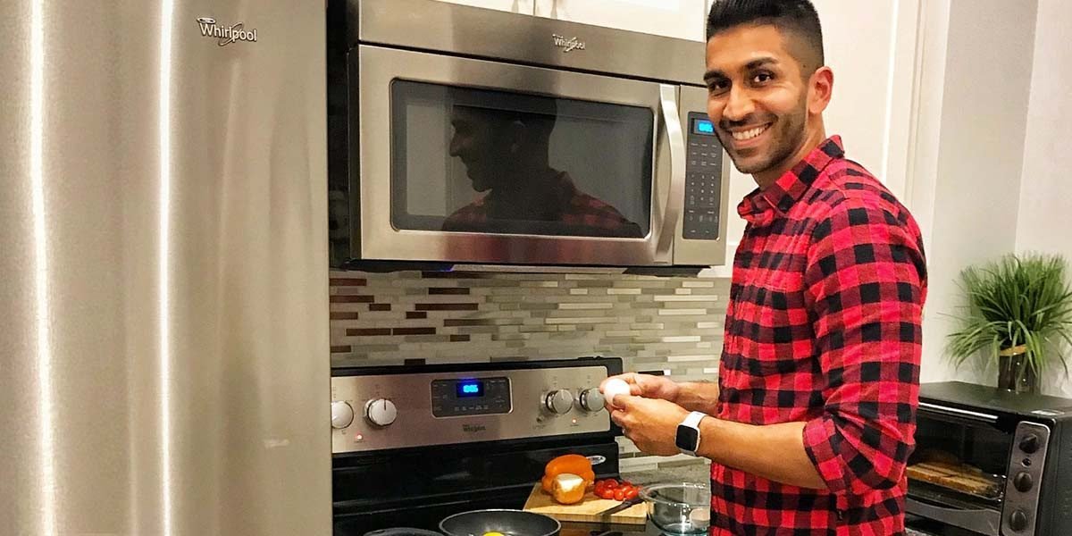 nabil karim cooking healthy meal in kitchen
