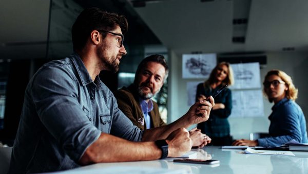 Men and women working togther in the office