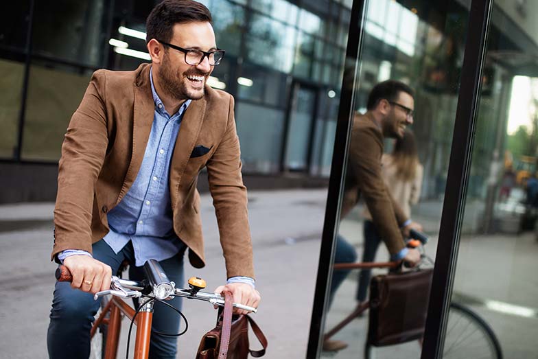 Man riding his bike to and from work