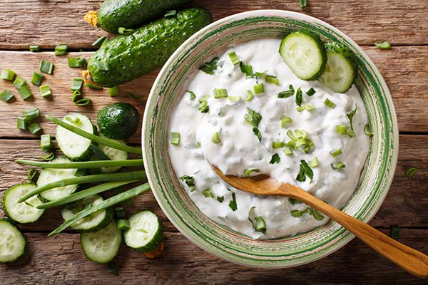 Raita made of curd with cucumber, herbs and spices