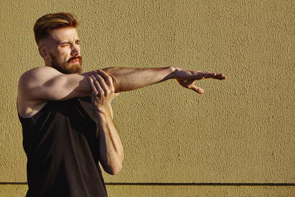 Man stretching out his arm