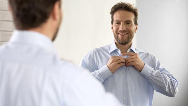 Man smiling in mirror