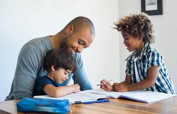 Dad helping kids with homework