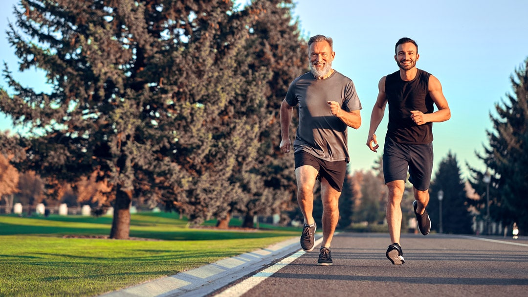 Two men running together