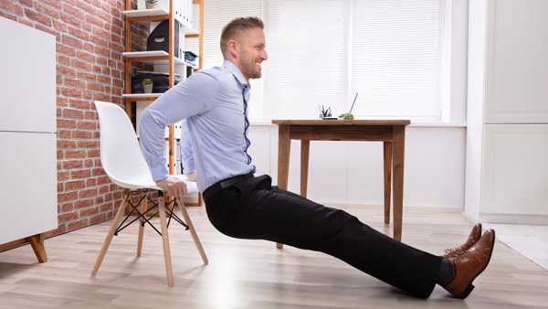 Man doing triceps dips