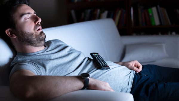 Man sleeping watching tv