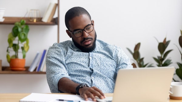 Unmotivated man at desk