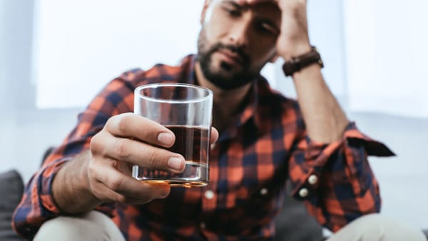 Man holding alcohol