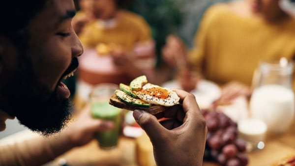 Man eating eggs