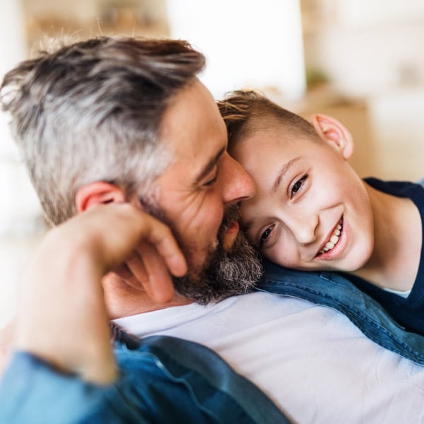 Dad sitting with his son