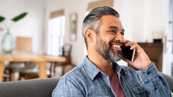 Man calling a friend on the phone