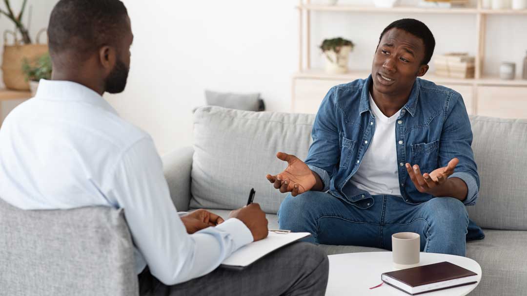 Man talking to counsellor