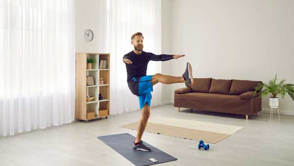 Man doing leg swings