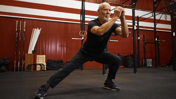 Man doing a side lunge