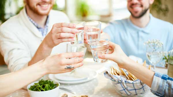 Group socializing while drinking water