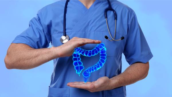 Doctor with graphic of colon