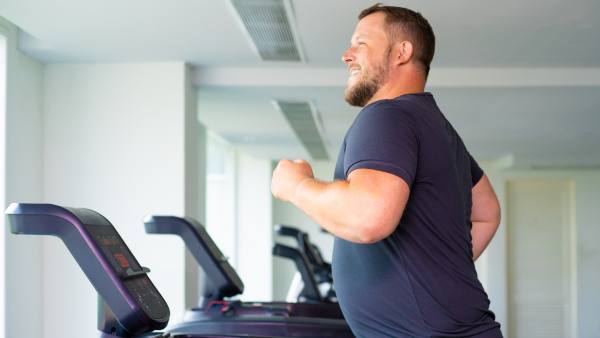 Smiling man on treadmill