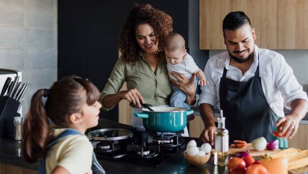 Latino family cooking together