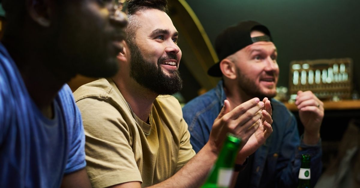 guys watching sports in pub