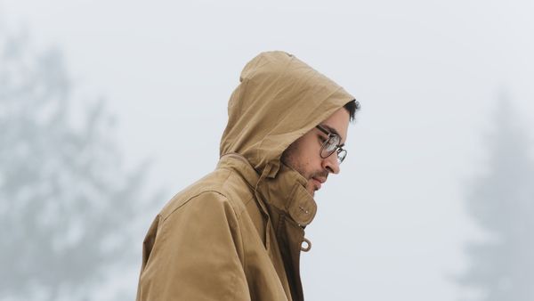 guy outside in winter with hood on