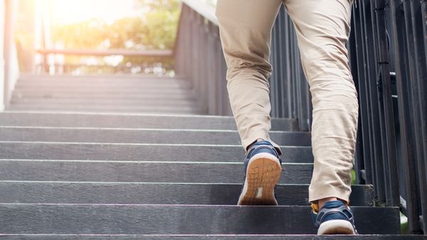 man walking up stairs