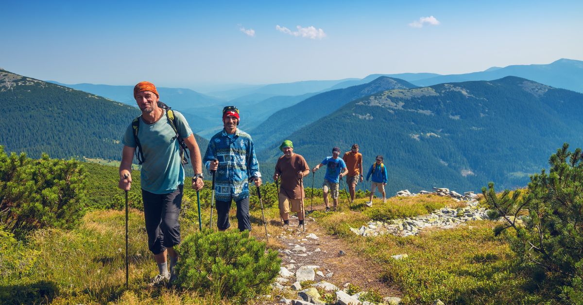 men on group hike